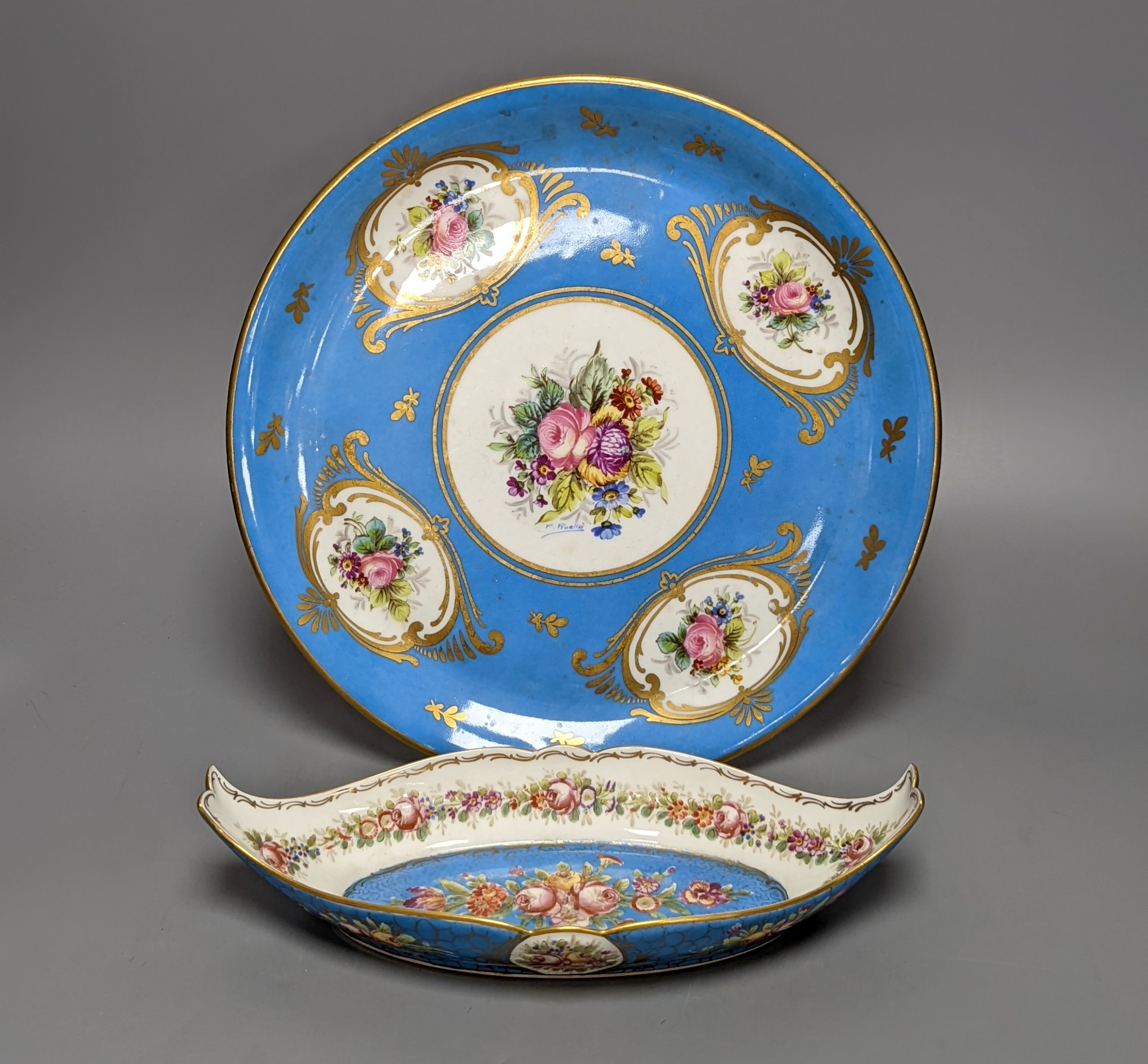A Sevres style boat shaped dish and a Limoges circular dish, Sevres dish 27 cms wide & Limoges dish 31 cms diameter.